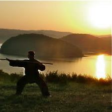 tai chi at sunset on a hill