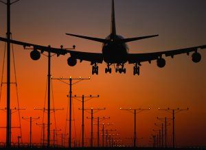 Plane landing sunset