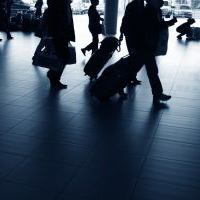 Travelers walking through airport