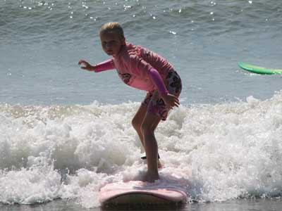 Kid surfing - Family Travel Planning