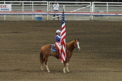 Rodeo rider with American flag