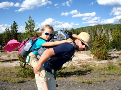 Violet Rides Piggyback With One of the Yellowstone Guides