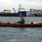 Brian Rowing In Front of a Tanker
