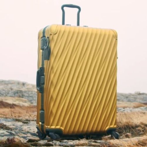 tumi yellow luggage